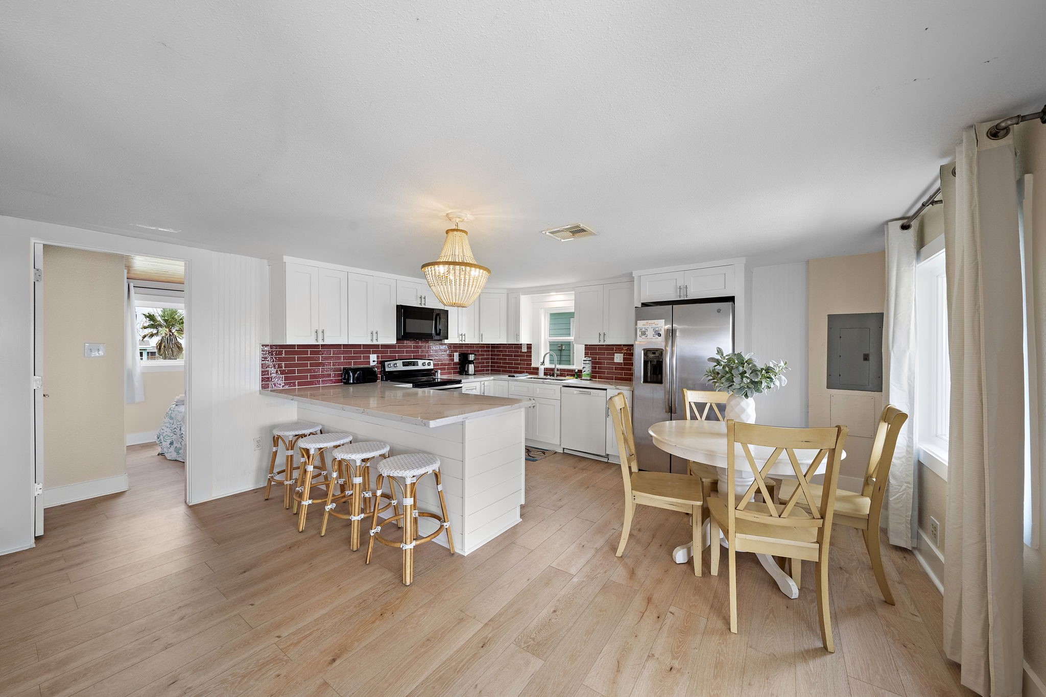 417 Olive Street Surfside Beach, TX 77541 - Photo 8 of 46 a view of a dining room with furniture and wooden floor