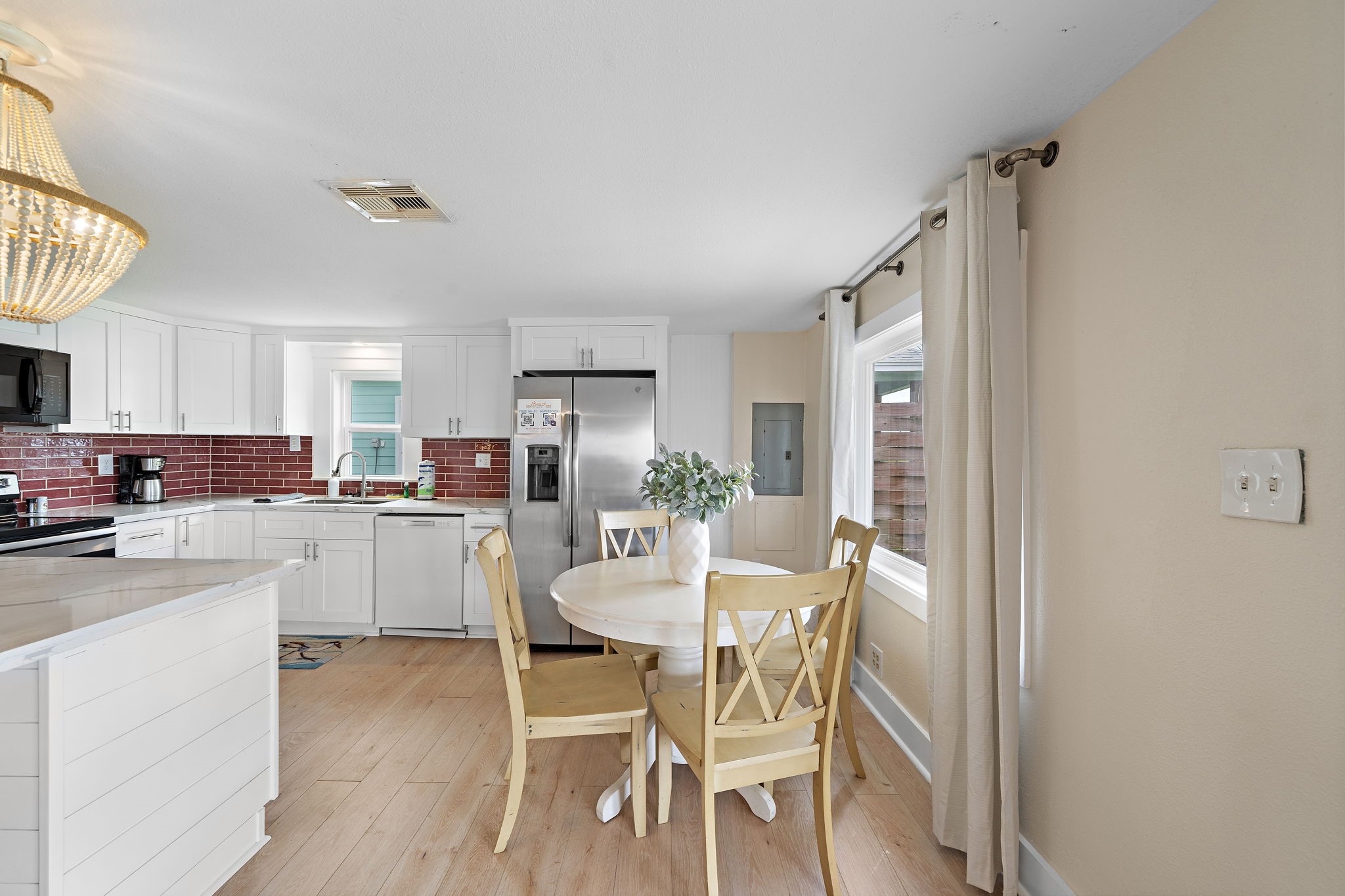 417 Olive Street Surfside Beach, TX 77541 - Photo 9 of 46 a dining room with furniture and window