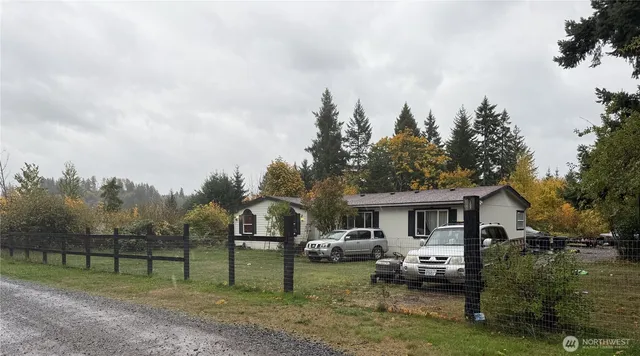a view of house with backyard and entertaining space
