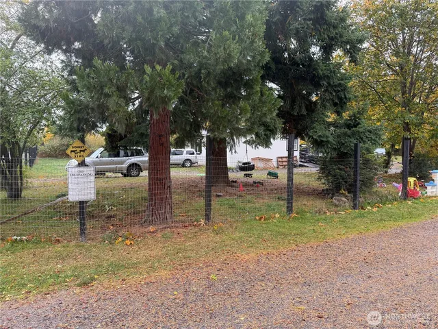 a backyard of a house with lots of green space
