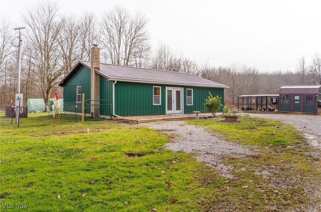 6590 Hall Road Andover, OH 44003 - Photo 1 of 29 View of front of house featuring an outbuilding, a metal roof