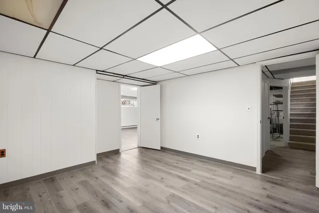 a view of a room with wooden floor