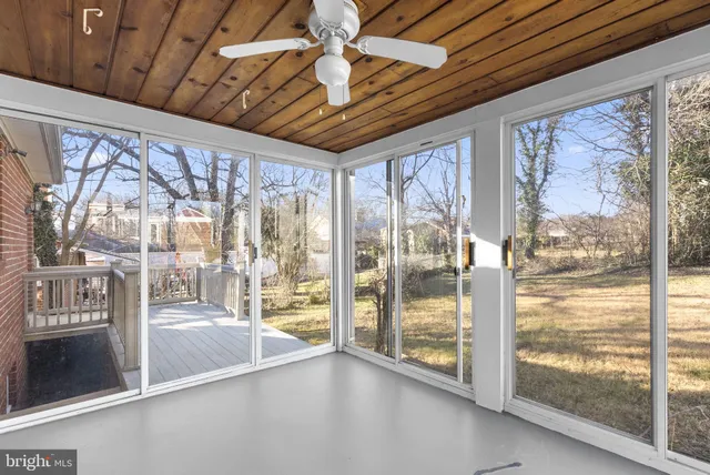 a view of an entryway with a floor to ceiling window