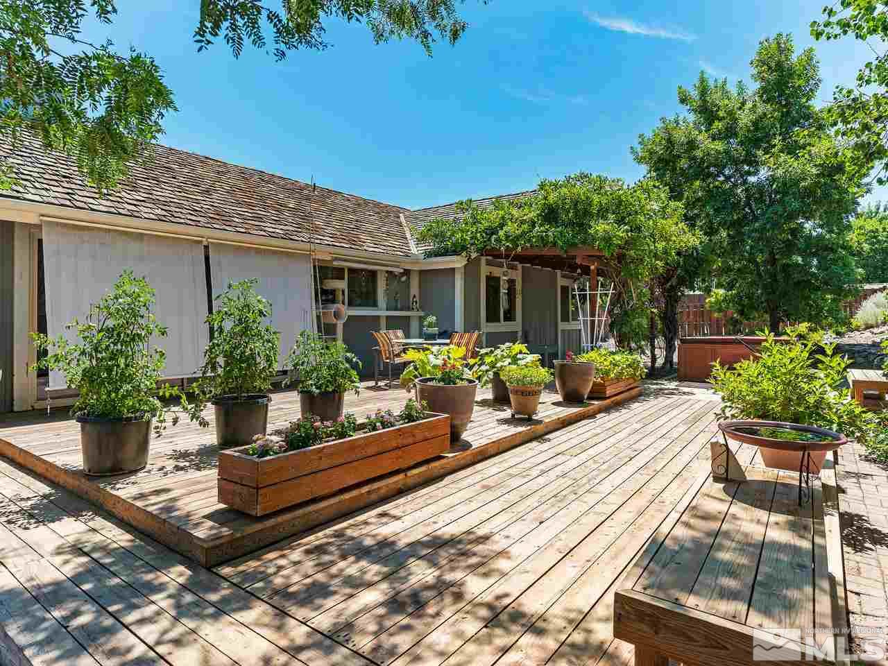 13055 Thomas Creek Road Reno, NV 89511 - Photo 17 of 24 a view of a backyard with sitting area