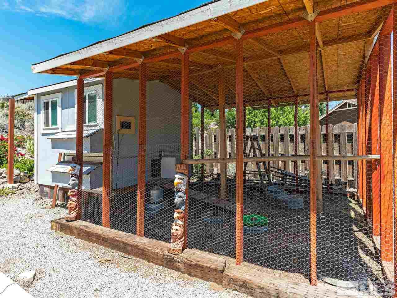 13055 Thomas Creek Road Reno, NV 89511 - Photo 23 of 24 a patio with water glass top table and chairs
