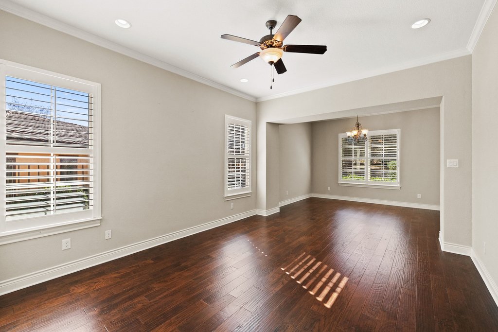404 Amiata Avenue, Unit 34 Austin, TX 78734 - Photo 13 of 26 a view of an empty room with wooden floor and a window