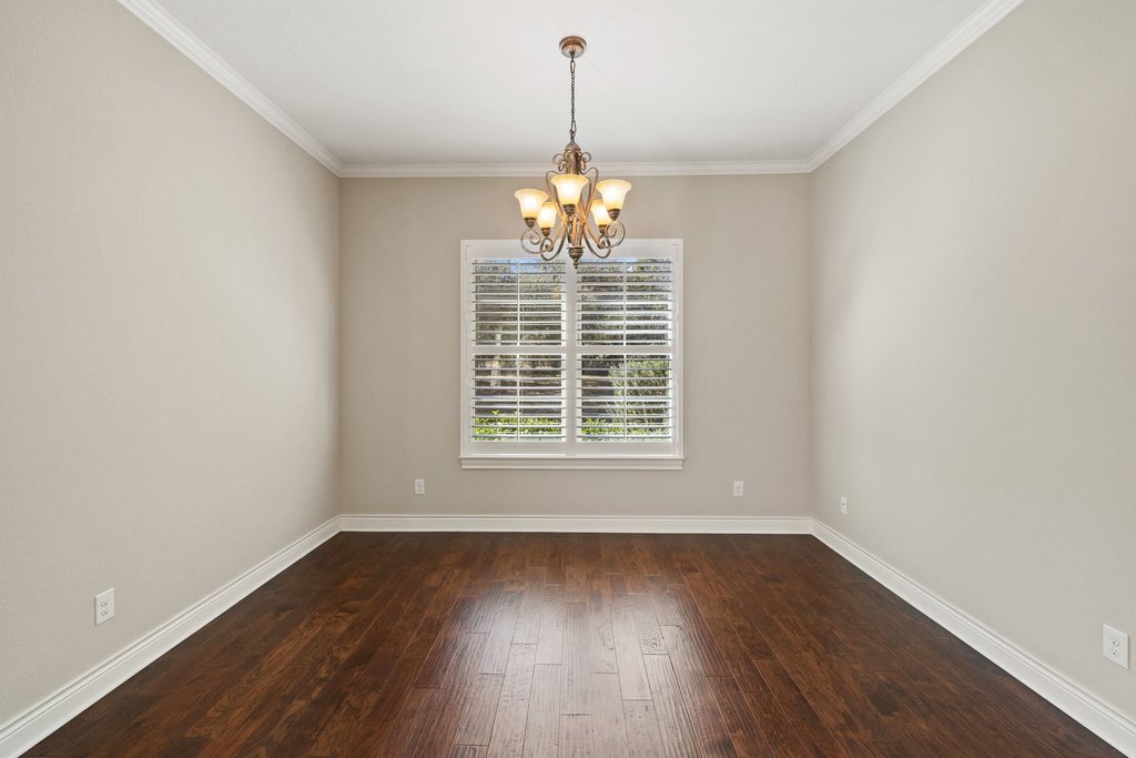 404 Amiata Avenue, Unit 34 Austin, TX 78734 - Photo 16 of 26 wooden floor in an empty room with a window
