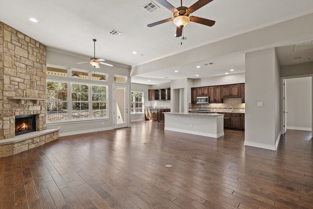 404 Amiata Avenue, Unit 34 Austin, TX 78734 - Photo 2 of 26 a view of a kitchen with a stove cabinets and wooden floor