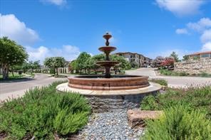 404 Amiata Avenue, Unit 34 Austin, TX 78734 - Photo 23 of 26 a front view of a house with a yard