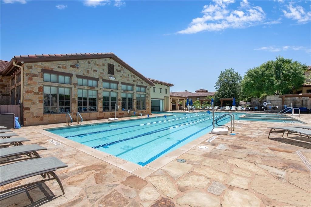 404 Amiata Avenue, Unit 34 Austin, TX 78734 - Photo 24 of 26 a view of a house with backyard porch and sitting area