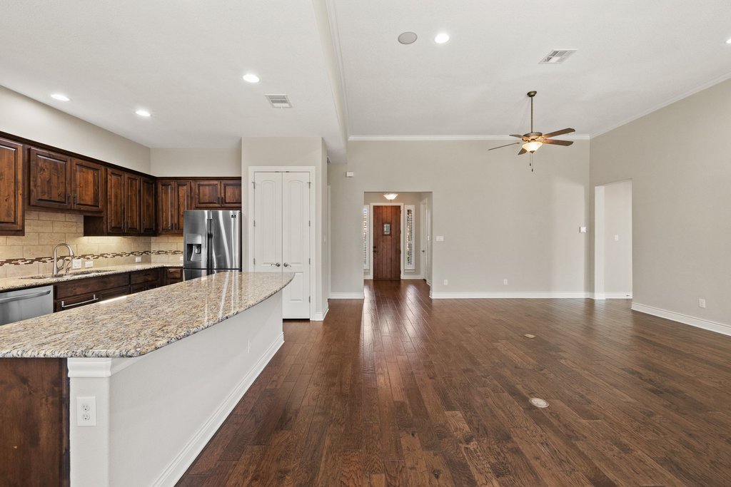 404 Amiata Avenue, Unit 34 Austin, TX 78734 - Photo 8 of 26 a view of a kitchen with cabinets stainless steel appliances and a center island