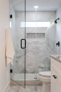a bathroom with a shower and toilet
