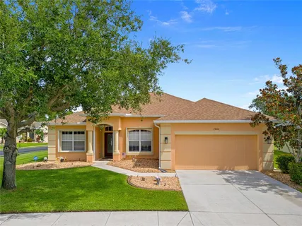 front view of a house with a garden