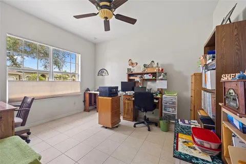 a room with workspace and a window