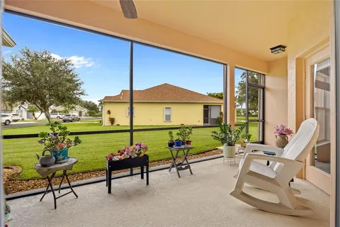 a building outdoor space with patio furniture and a garden