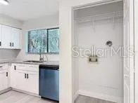 a kitchen with a sink and cabinets