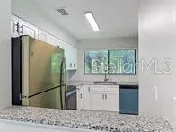 a view of a big room with windows and closet