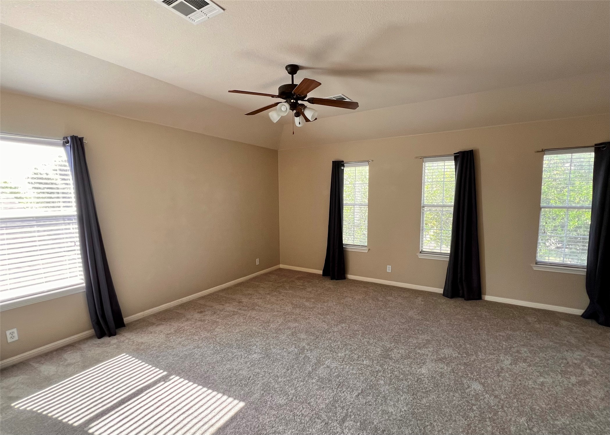 16616 Bridgefarmer Boulevard Pflugerville, TX 78660 - Photo 16 of 36 an empty room with windows and fan