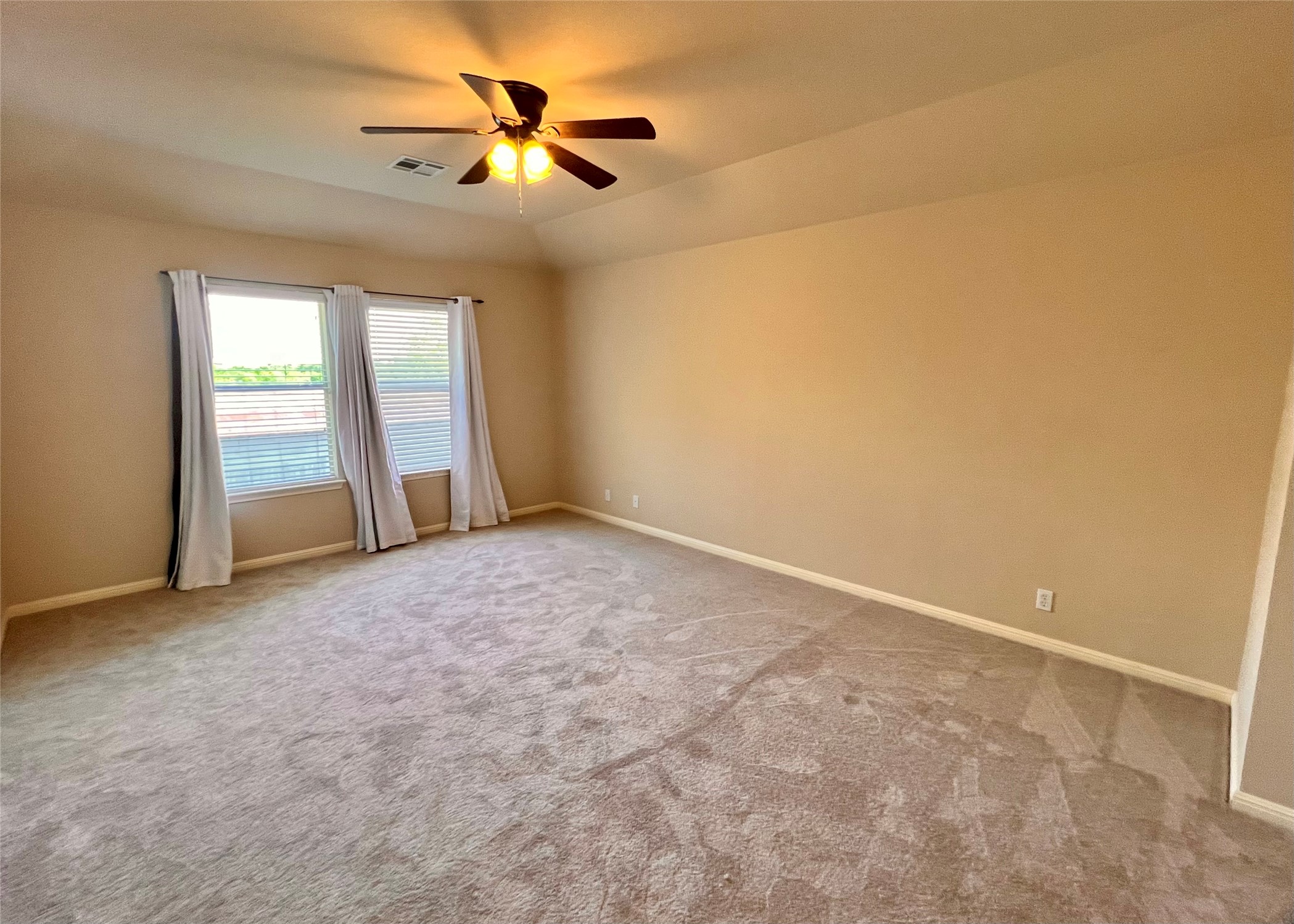 16616 Bridgefarmer Boulevard Pflugerville, TX 78660 - Photo 17 of 36 an empty room with windows and fan