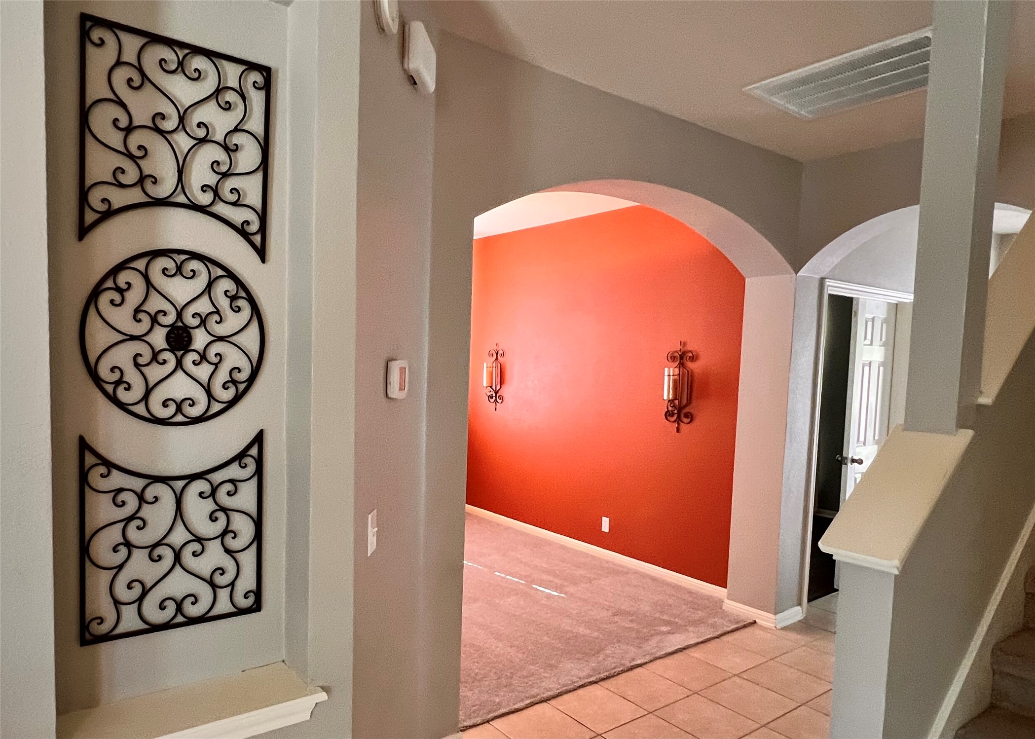 16616 Bridgefarmer Boulevard Pflugerville, TX 78660 - Photo 9 of 36 a view of a hallway with paintings on the wall
