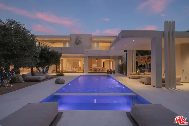 a swimming pool with outdoor seating