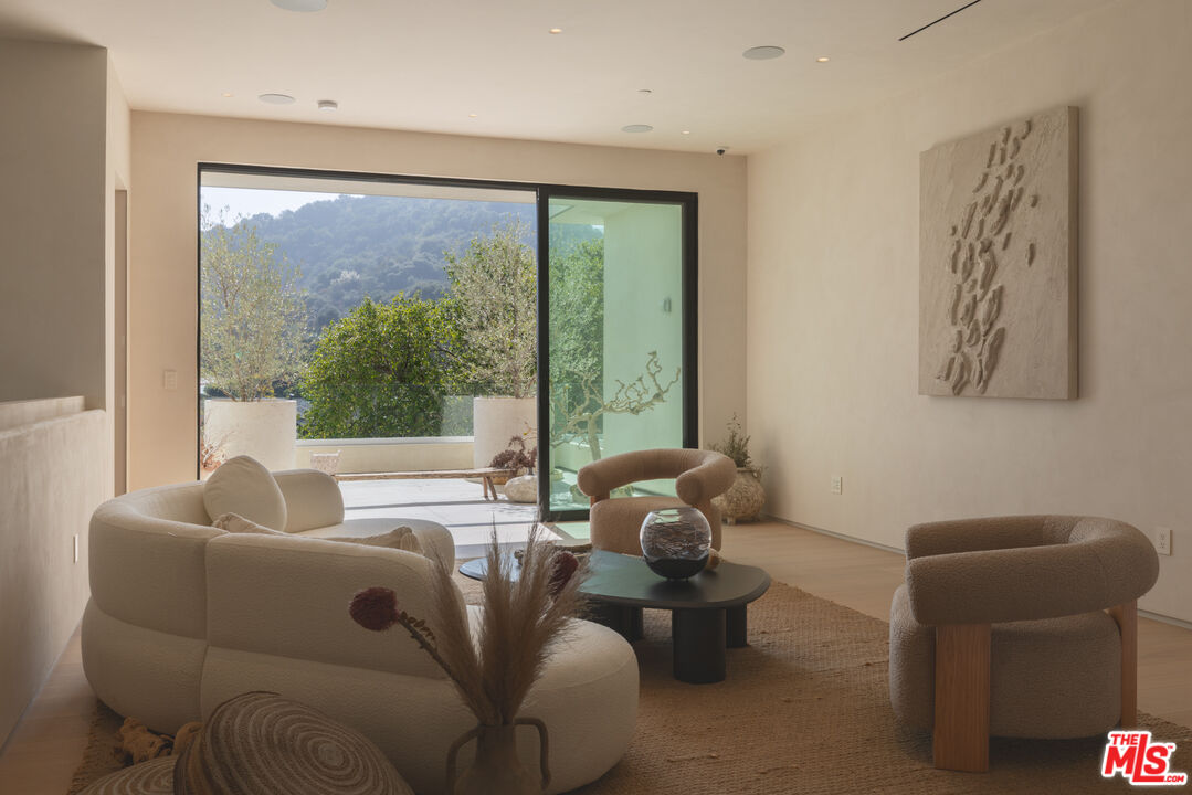 17177 Adlon Road Encino, CA 91436 - Photo 12 of 20 a living room with furniture and a large window