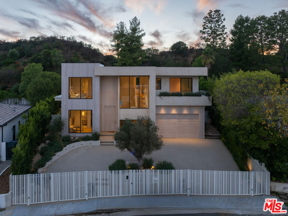 17177 Adlon Road Encino, CA 91436 - Photo 15 of 20 a front view of house with yard and green space