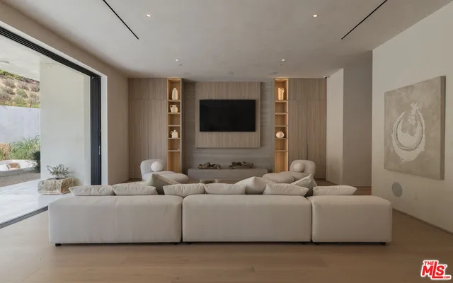 a kitchen with refrigerator and cabinets