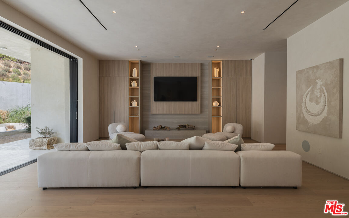 17177 Adlon Road Encino, CA 91436 - Photo 6 of 20 a living room with furniture and a flat screen tv