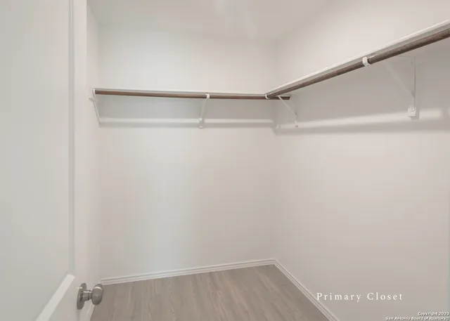 a view of an empty walk in closet