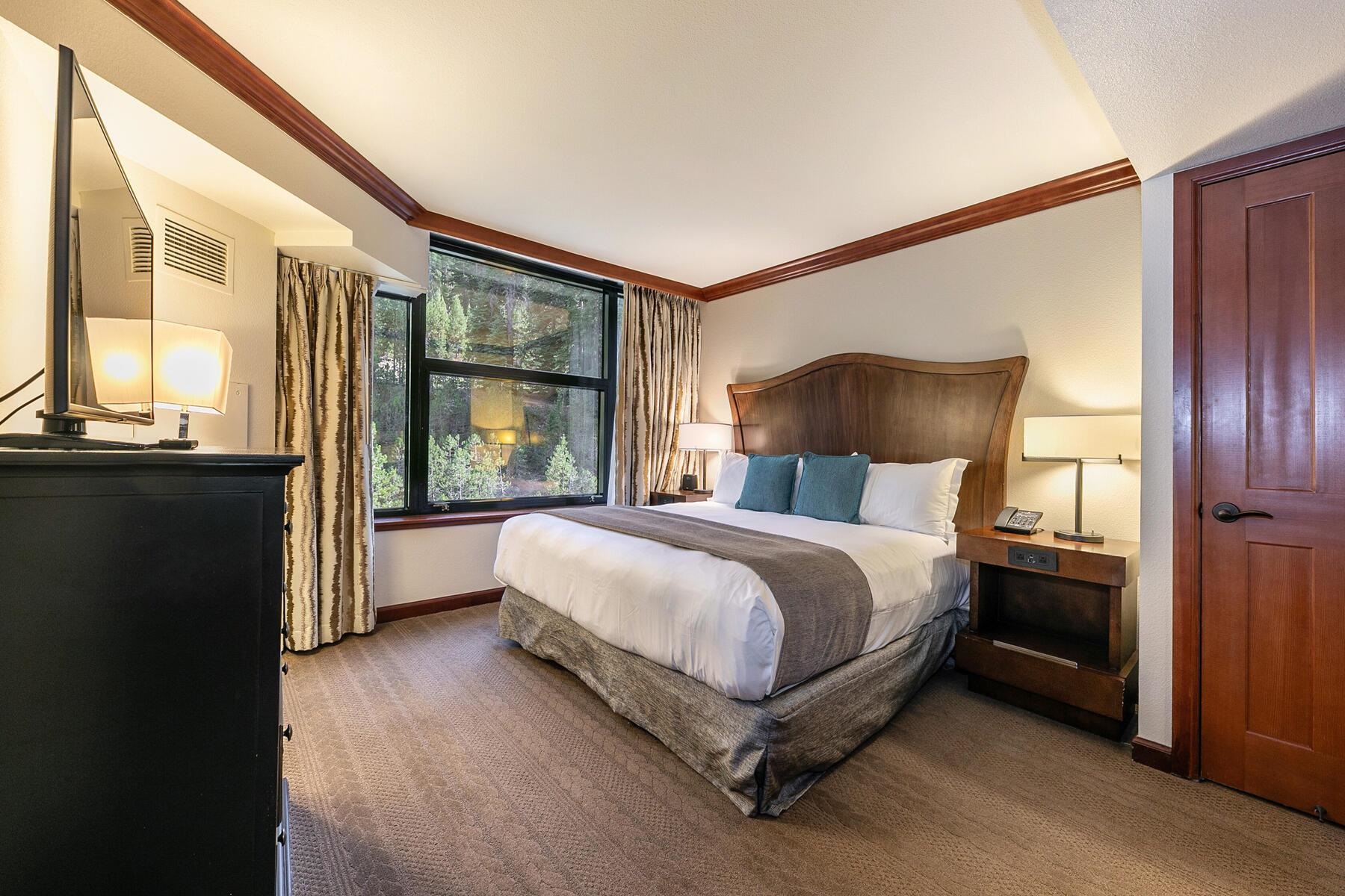 400 Resort Road, Unit 445/447 Olympic Valley, CA 96146 - Photo 13 of 27 a spacious bedroom with a bed and a large window