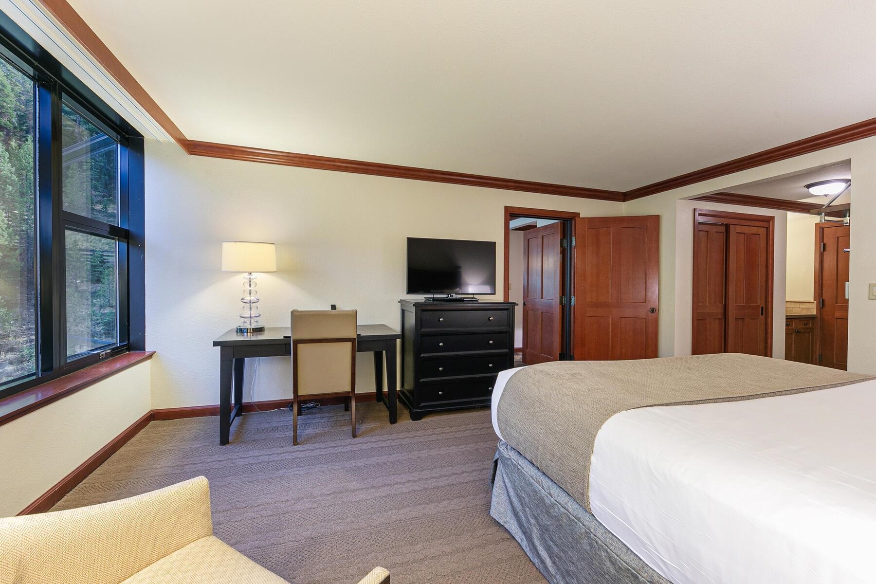 400 Resort Road, Unit 445/447 Olympic Valley, CA 96146 - Photo 20 of 27 a bedroom with a bed and a flat screen tv