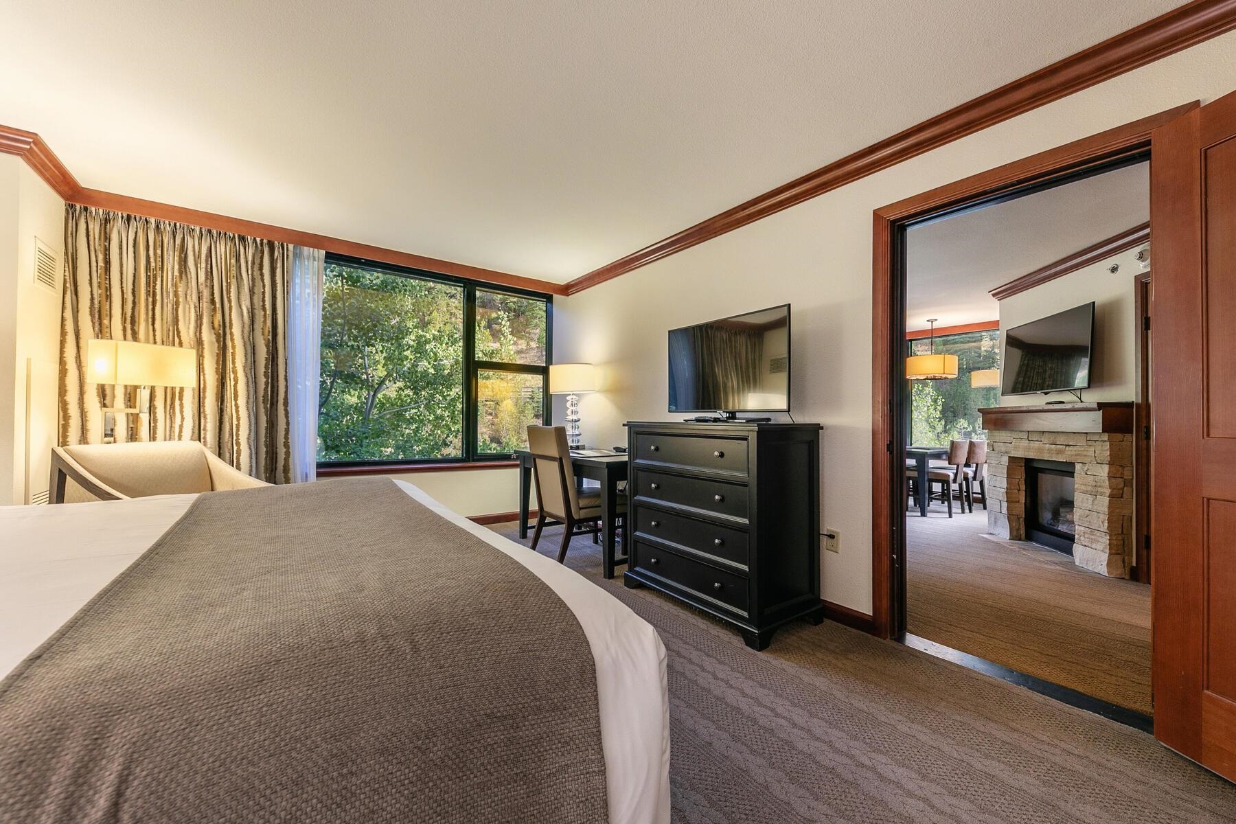 400 Resort Road, Unit 445/447 Olympic Valley, CA 96146 - Photo 24 of 27 a bedroom with a bed and a television on table