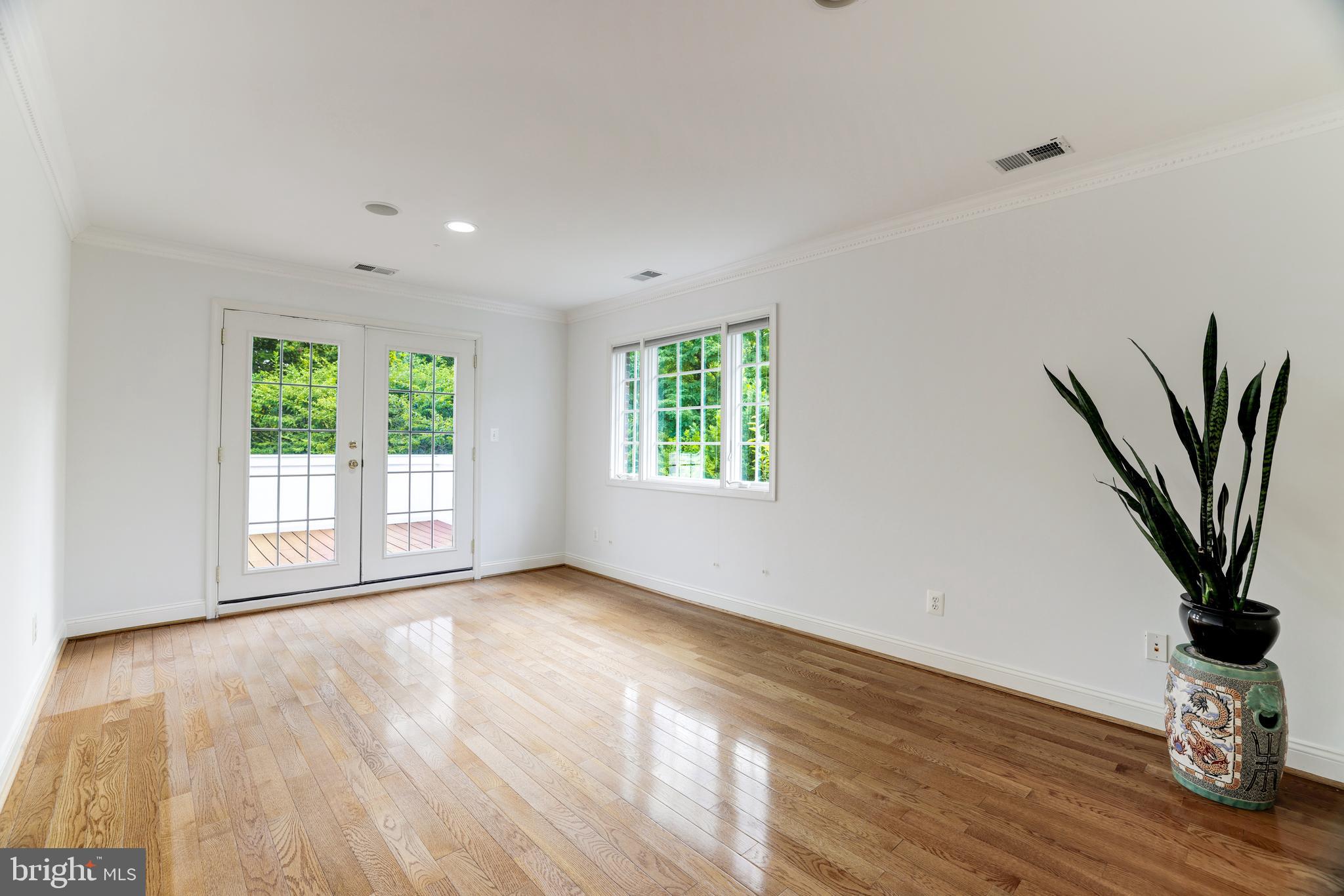 6318 Georgetown Pike McLean, VA 22101 - Photo 32 of 47 a view of a room with window and wooden floor