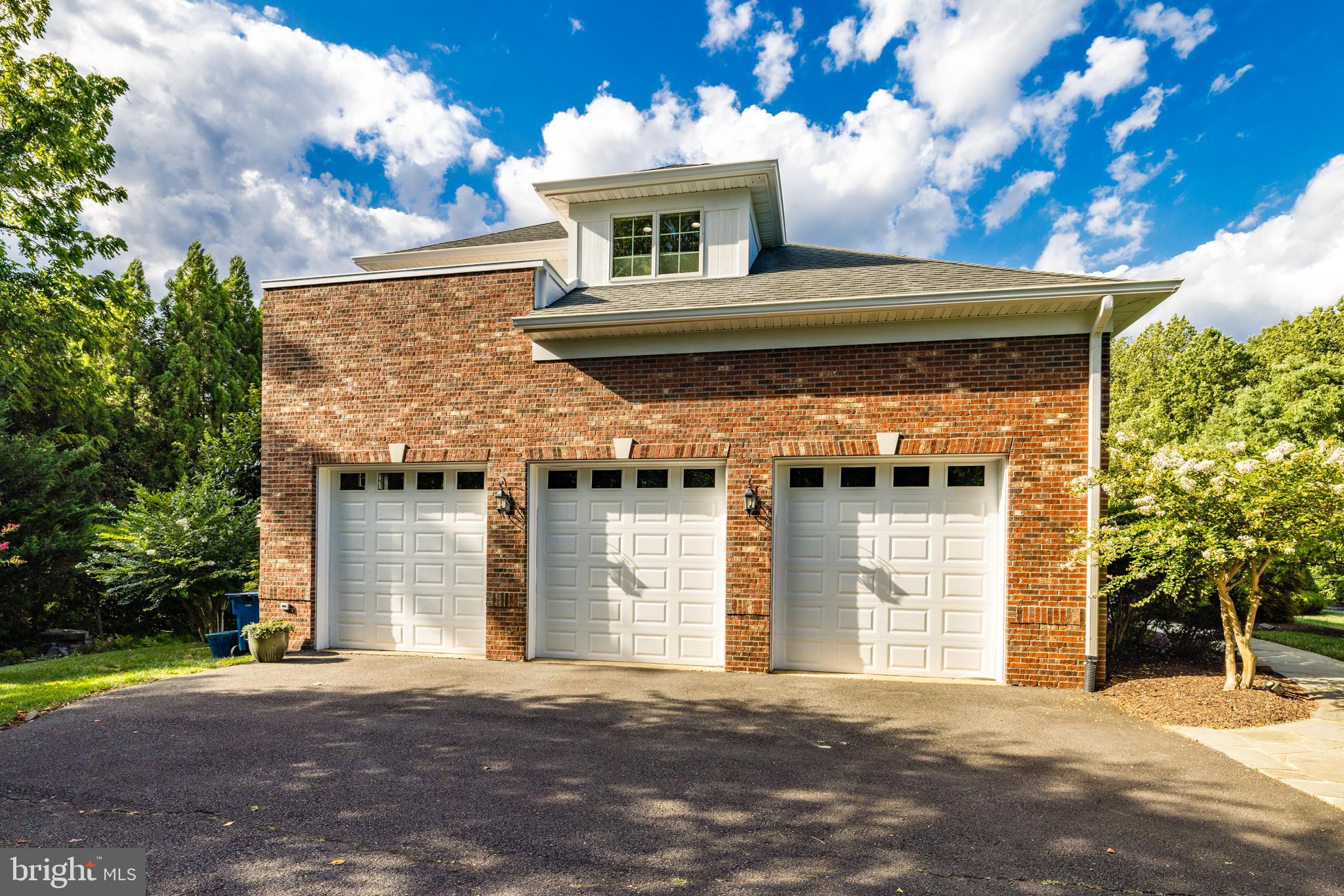 6318 Georgetown Pike McLean, VA 22101 - Photo 37 of 47 a front view of a house with a garden