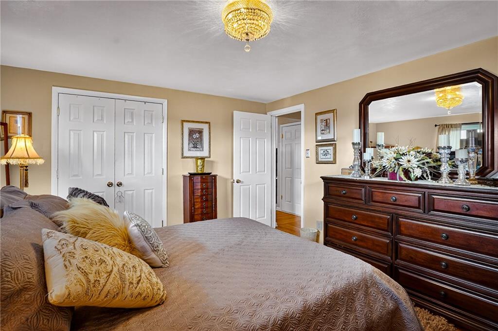 104 Thorncrest Drive McKees Rocks, PA 15136 - Photo 14 of 34 a bedroom with a bed and a dresser