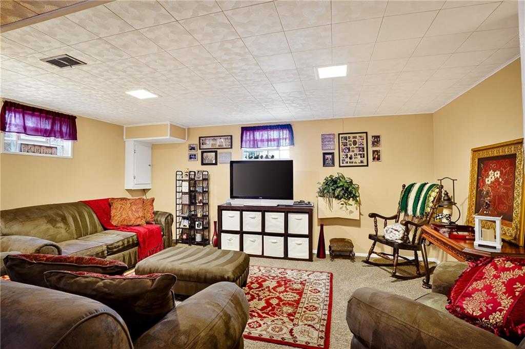 104 Thorncrest Drive McKees Rocks, PA 15136 - Photo 22 of 34 a living room with furniture and a flat screen tv