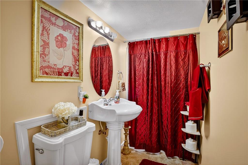 104 Thorncrest Drive McKees Rocks, PA 15136 - Photo 26 of 34 a bathroom with a sink and a mirror
