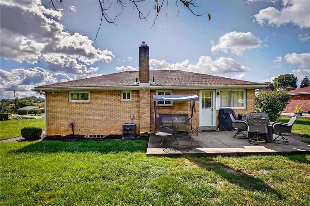104 Thorncrest Drive McKees Rocks, PA 15136 - Photo 29 of 34 a view of a house with backyard sitting area and garden