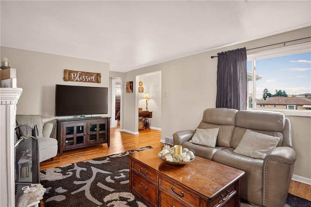 104 Thorncrest Drive McKees Rocks, PA 15136 - Photo 5 of 34 a living room with furniture and a flat screen tv