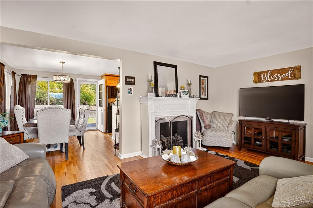 104 Thorncrest Drive McKees Rocks, PA 15136 - Photo 6 of 34 a living room with furniture a flat screen tv and a fireplace