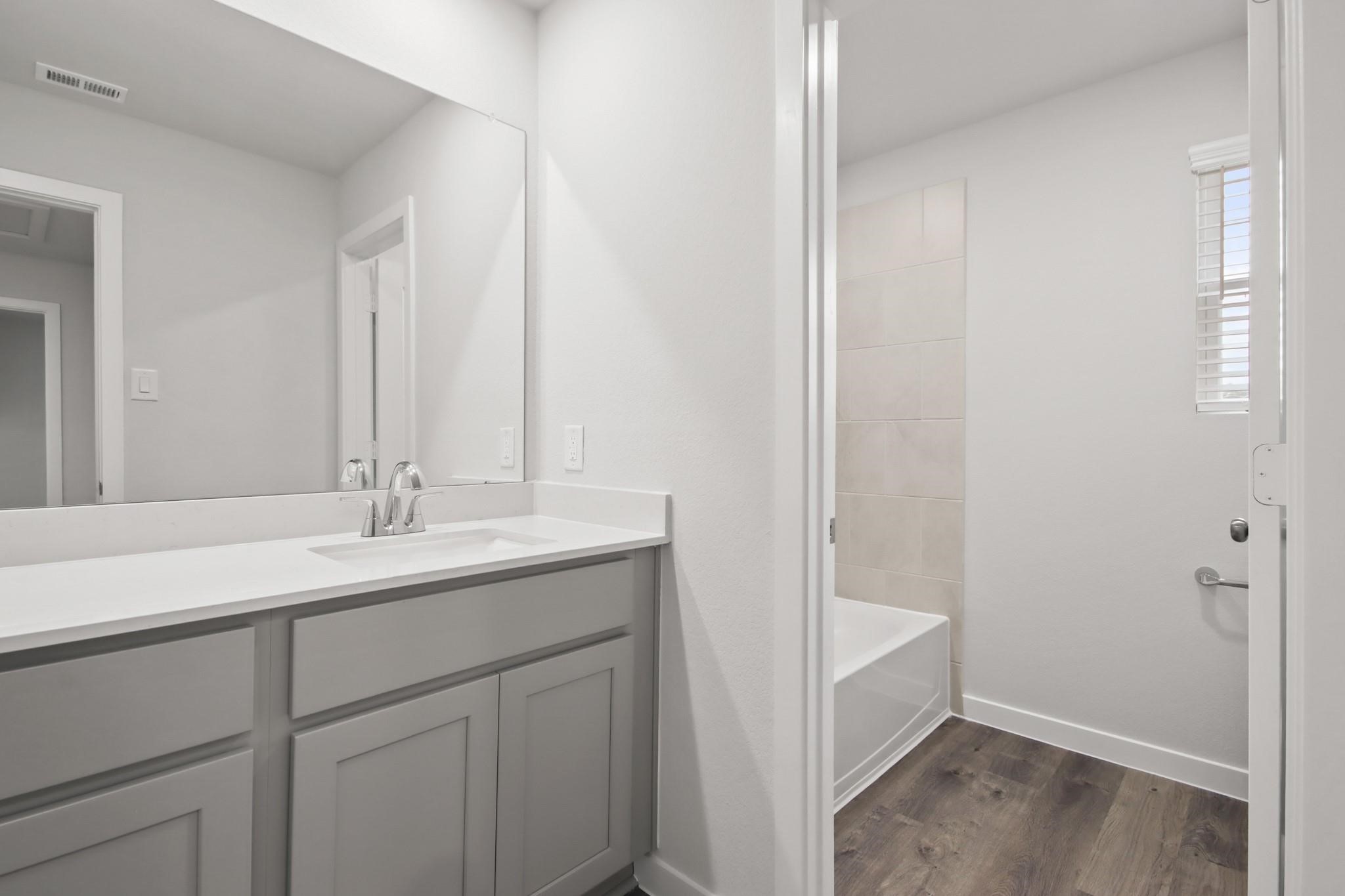 227 Brazen Forest Trail Magnolia, TX 77354 - Photo 13 of 22 a bathroom with a sink and a mirror