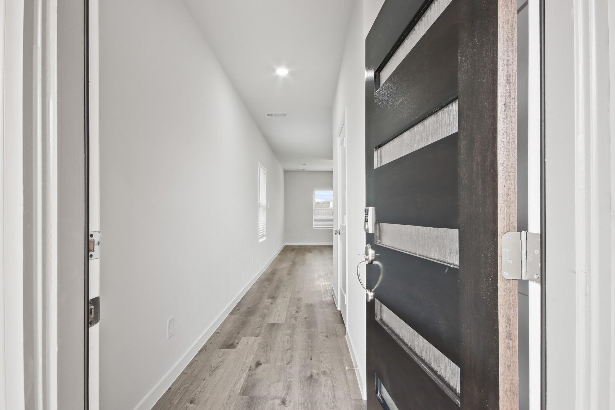 227 Brazen Forest Trail Magnolia, TX 77354 - Photo 2 of 22 a view of hallway with stairs