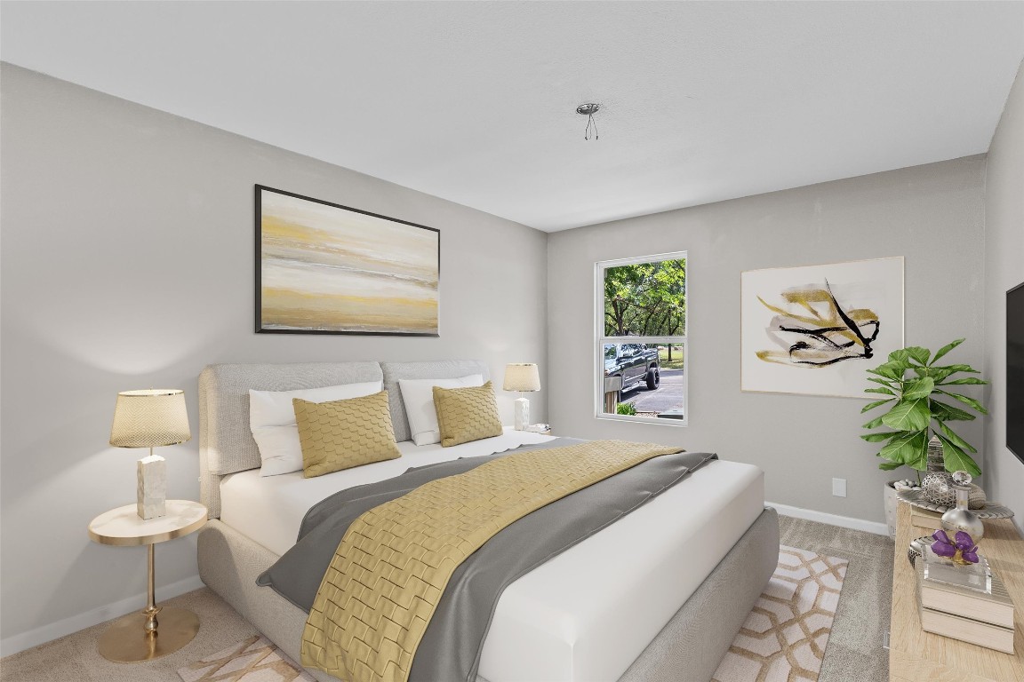 103 Comanche Drive Point Venture, TX 78645 - Photo 14 of 38 a bedroom with a bed and a painting on the wall