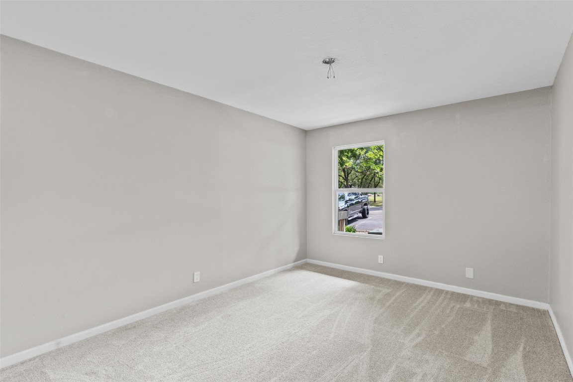 103 Comanche Drive Point Venture, TX 78645 - Photo 15 of 38 an empty room with windows