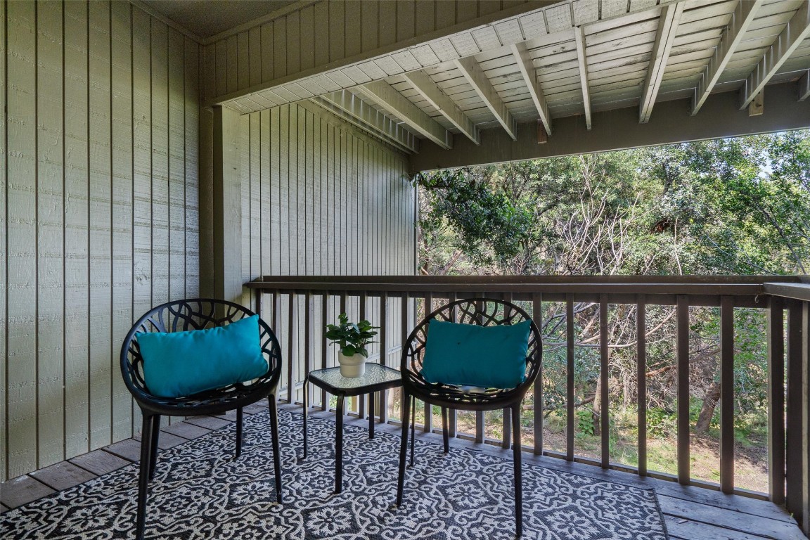 103 Comanche Drive Point Venture, TX 78645 - Photo 26 of 38 a balcony with table and chairs