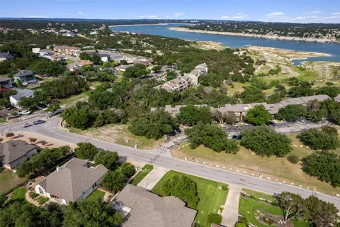 an aerial view of lake with residential houses with outdoor space and ocean view