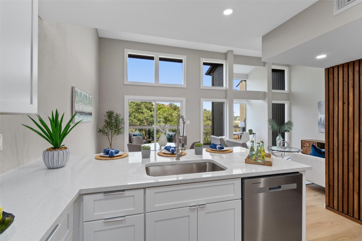 103 Comanche Drive Point Venture, TX 78645 - Photo 38 of 38 a kitchen with sink a window and potted plant