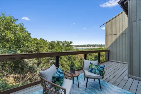 a view of a chairs and table in patio