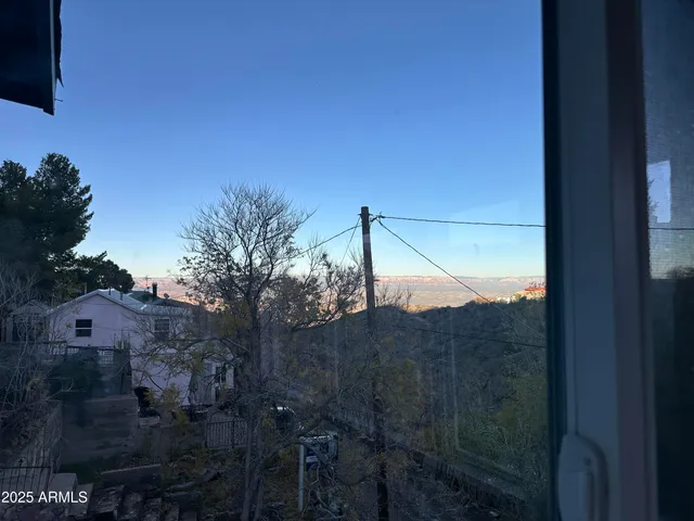a view of a balcony with a tree
